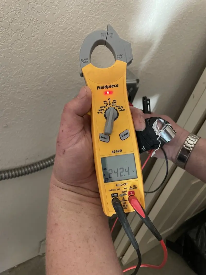 Voltage testing with clamp meter during Circuit Breaker Repair in Minerva